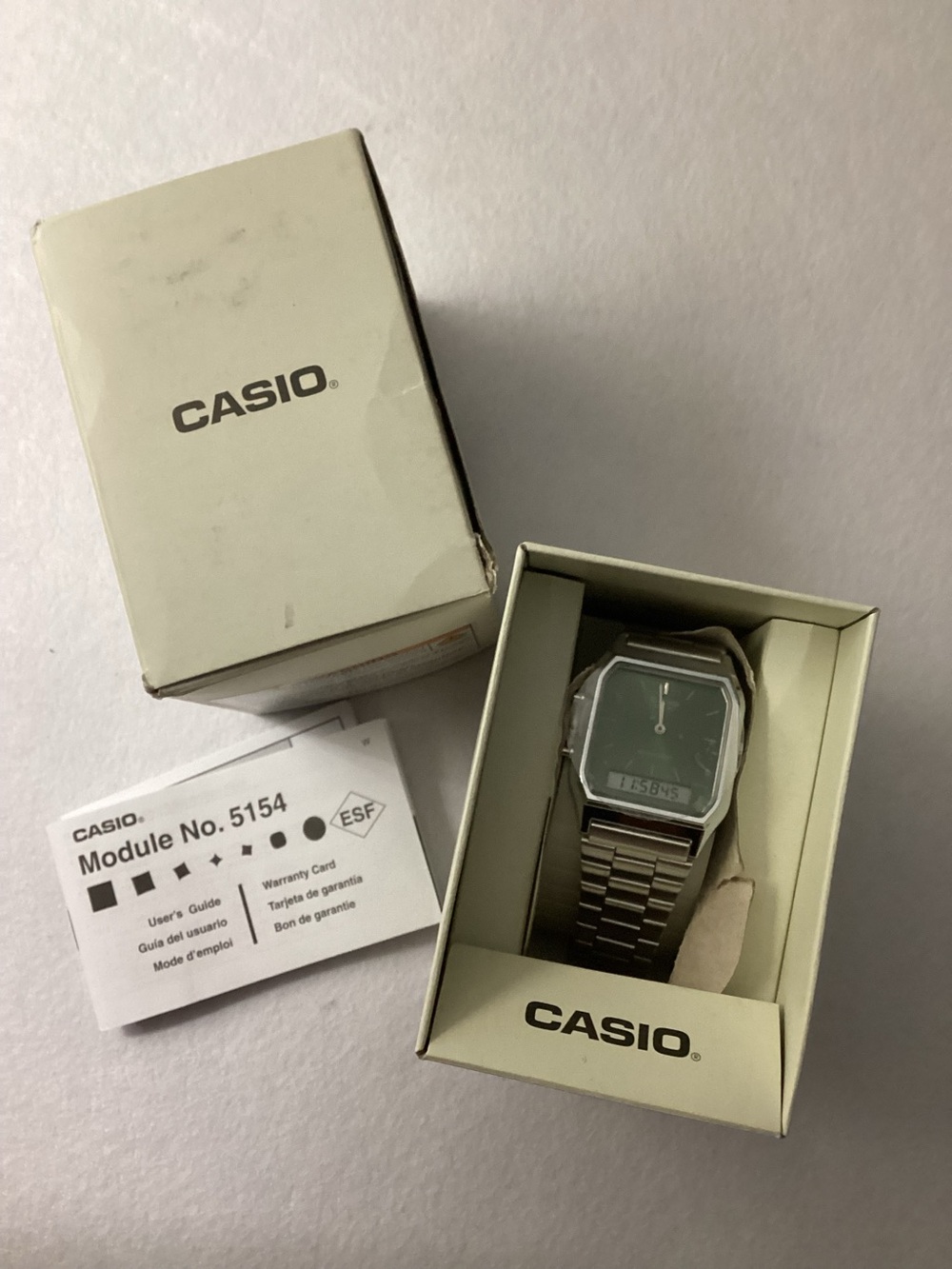 Casio Silver Watch with Green Dial and Stainless Bracelet